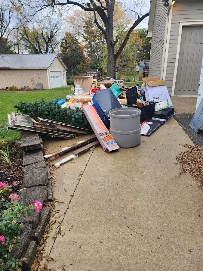 Dumpster being loaded with debris for 3 Yard Dumpster Rental in Mantua